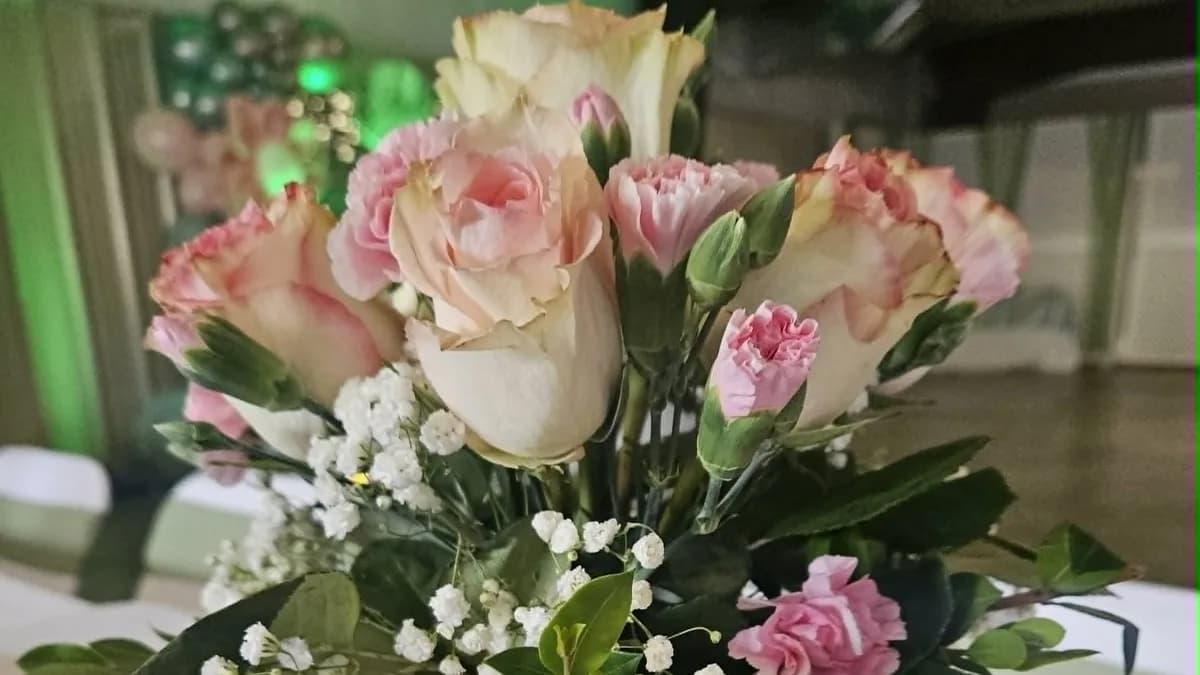 Pink and cream floral centerpiece with greenery
