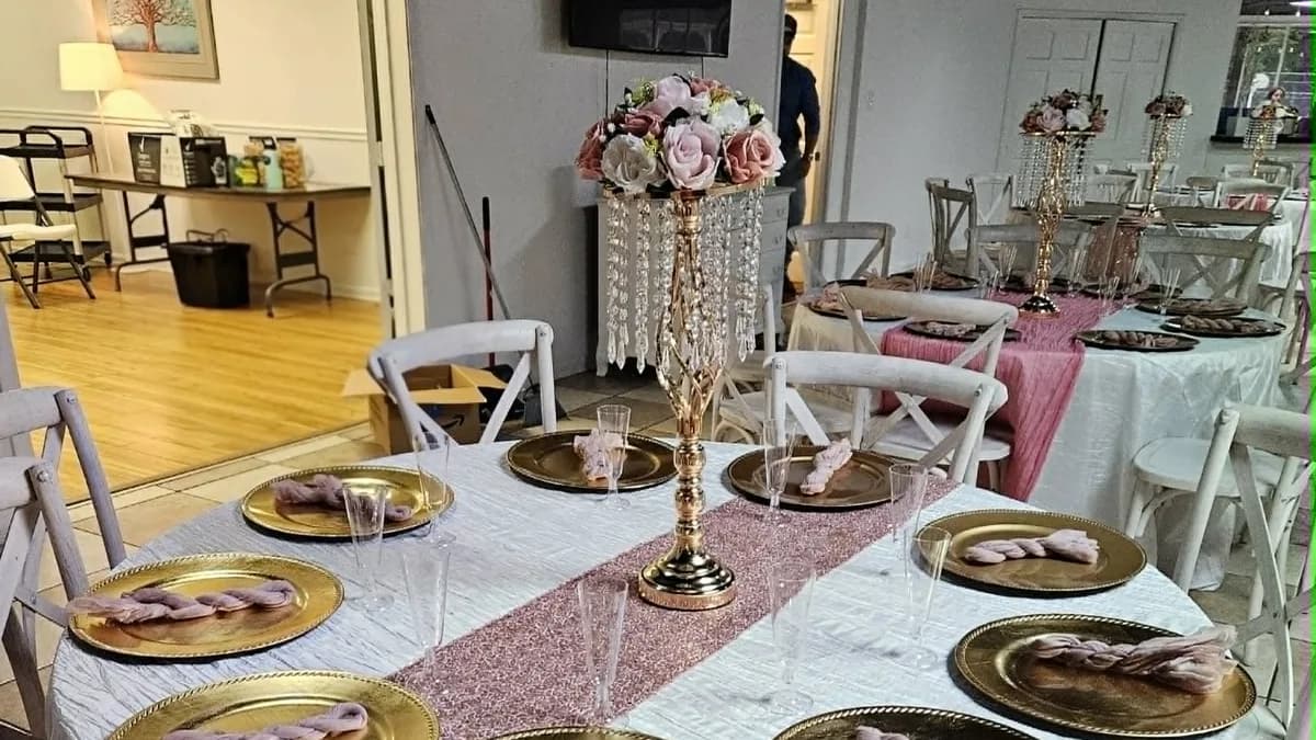 Pink and gold reception tables with tall floral centerpieces